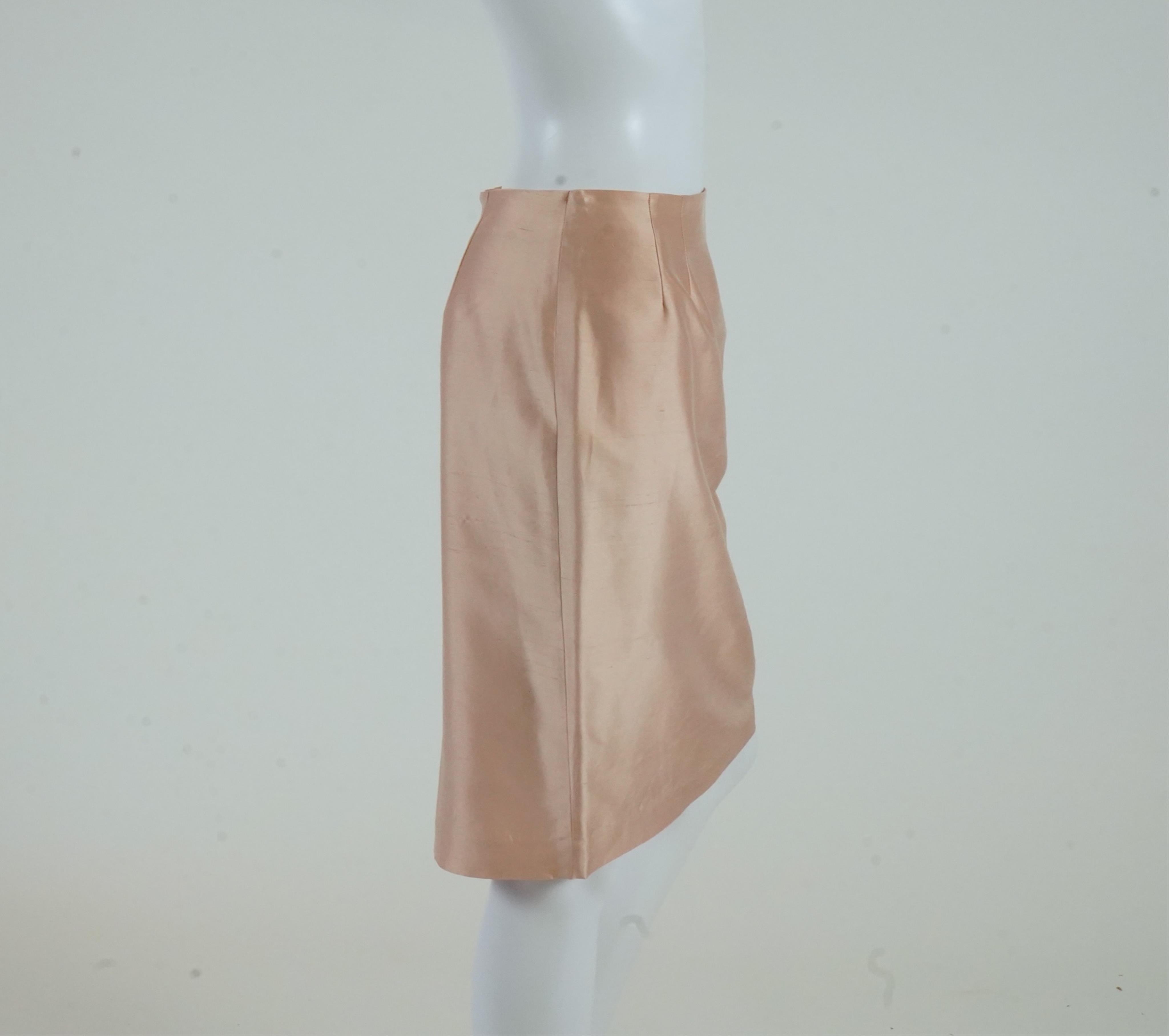 A Lea Rome grey skirt suit and a pale pink skirt